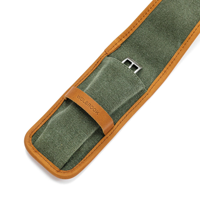 Close-up of green canvas watch pouch with tan leather band and edge binding