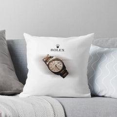 White throw pillow printed with a two-tone luxury watch on a grey sofa